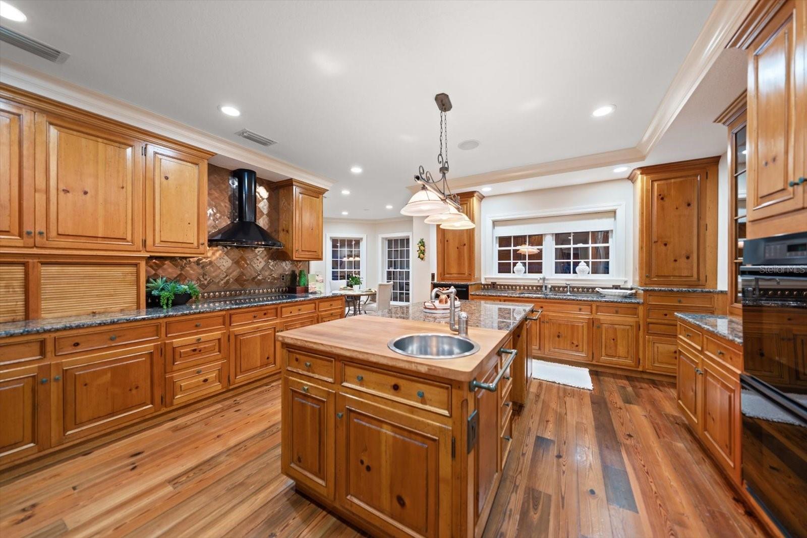 Storage is never an issue! Imagine the enjoyment of culinary experiences in this fully equipped exquisite kitchen-Induction cook top, with attractive hood, double oven, prep sink in center island and much more!