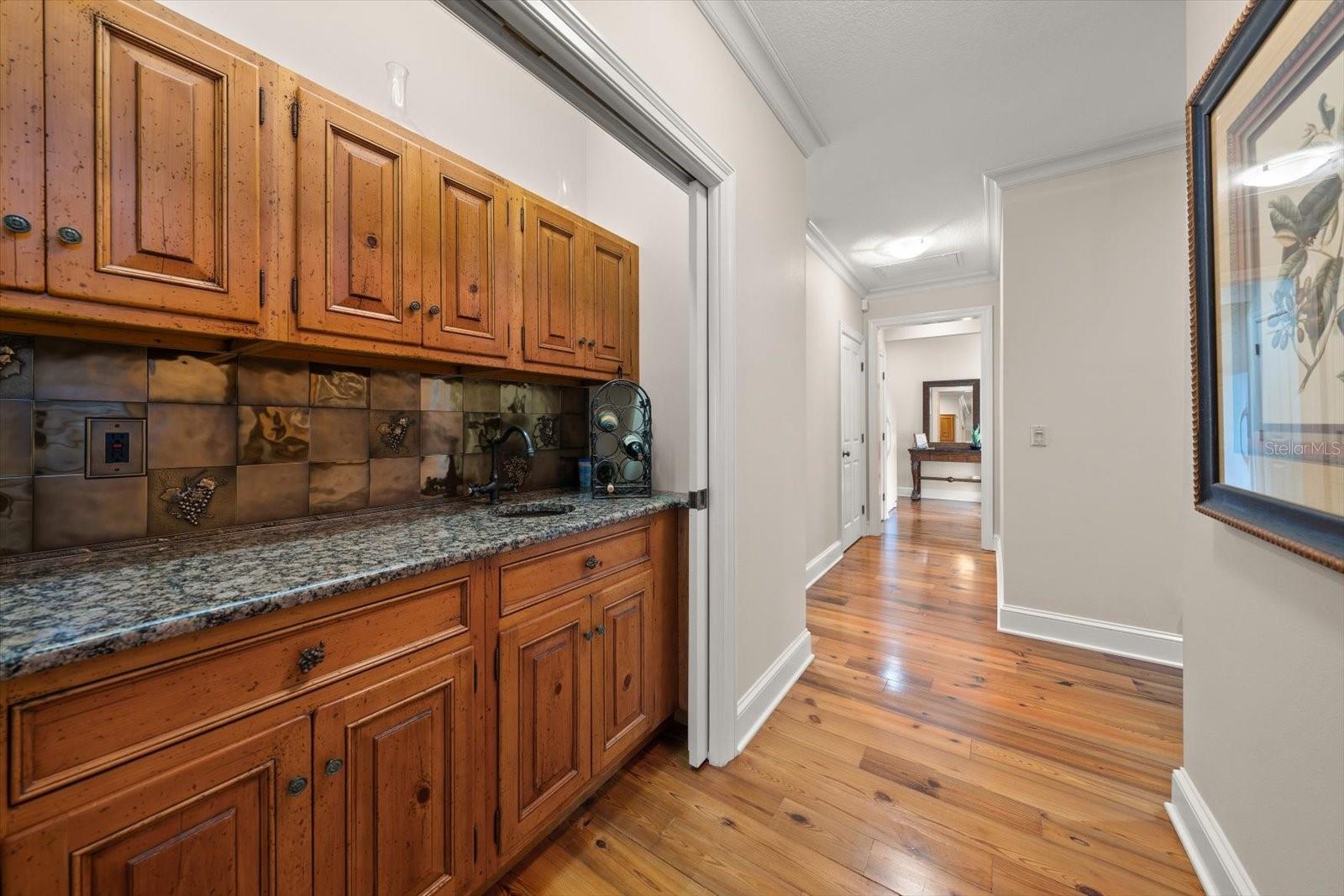 Wet bar area with pocket doors.