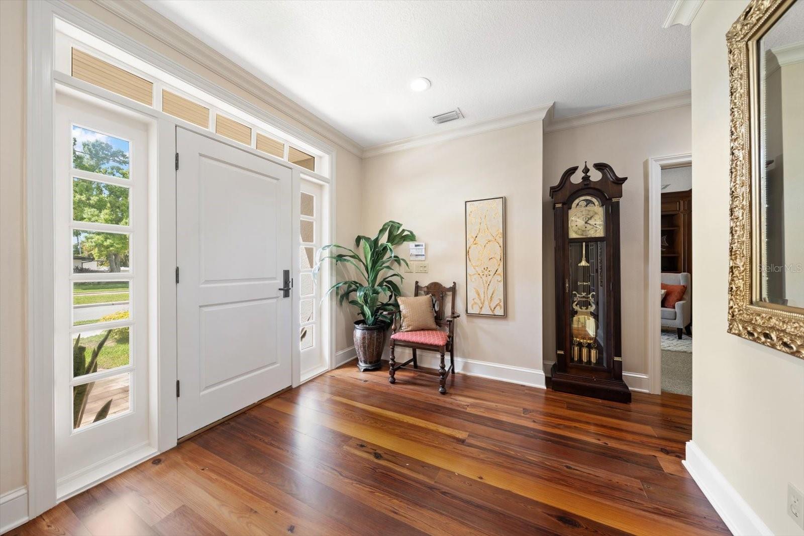 Welcoming foyer enhanced by abundant natural light.