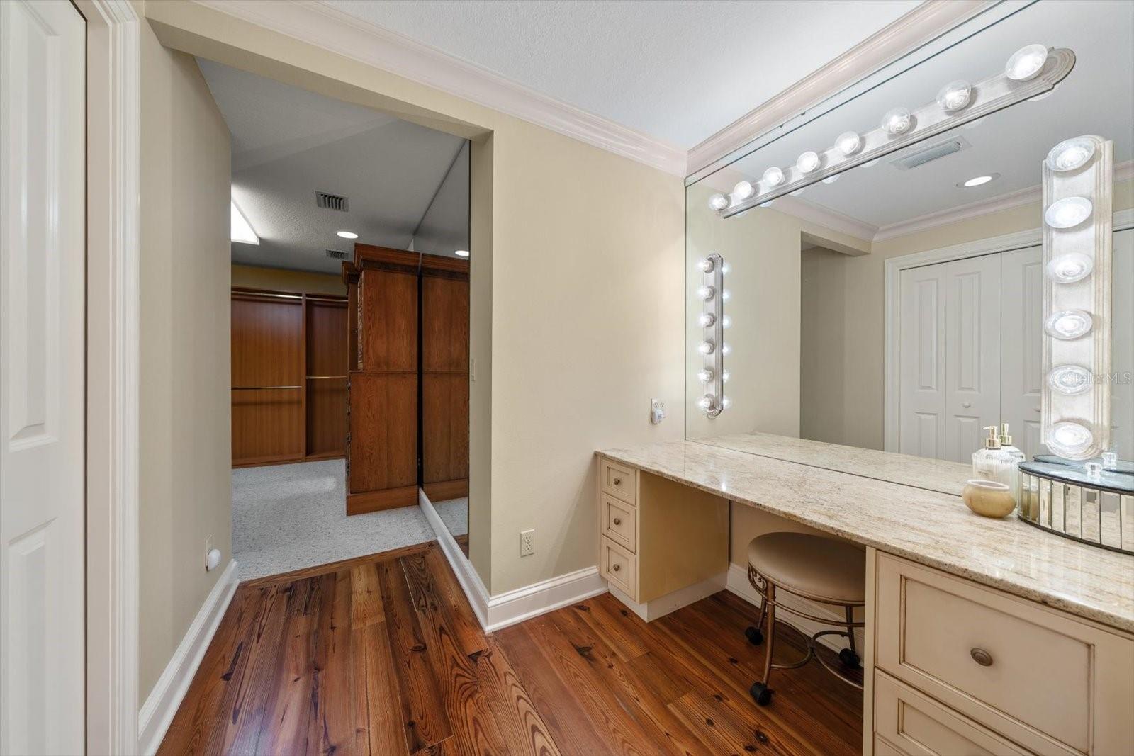 Make up area enhanced by vanity lighting in primary suite area.