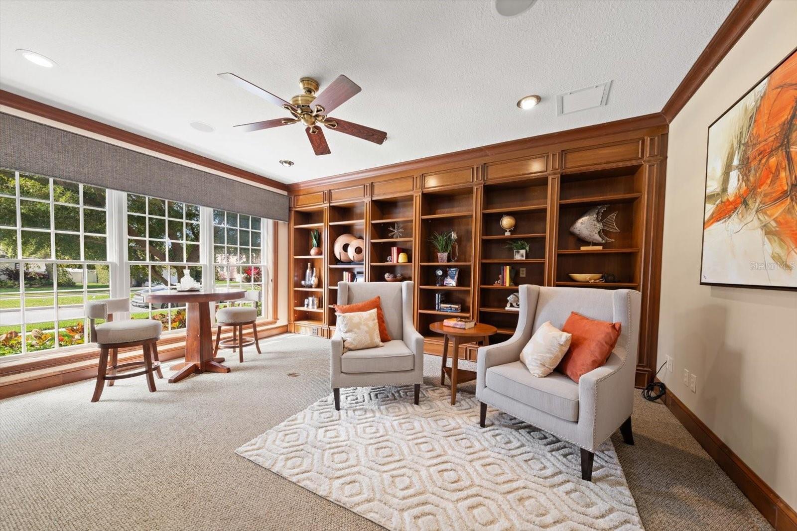 Library/den is spacious (18x17). Attractive built-ins, and wall of glass, this is a lovely space.