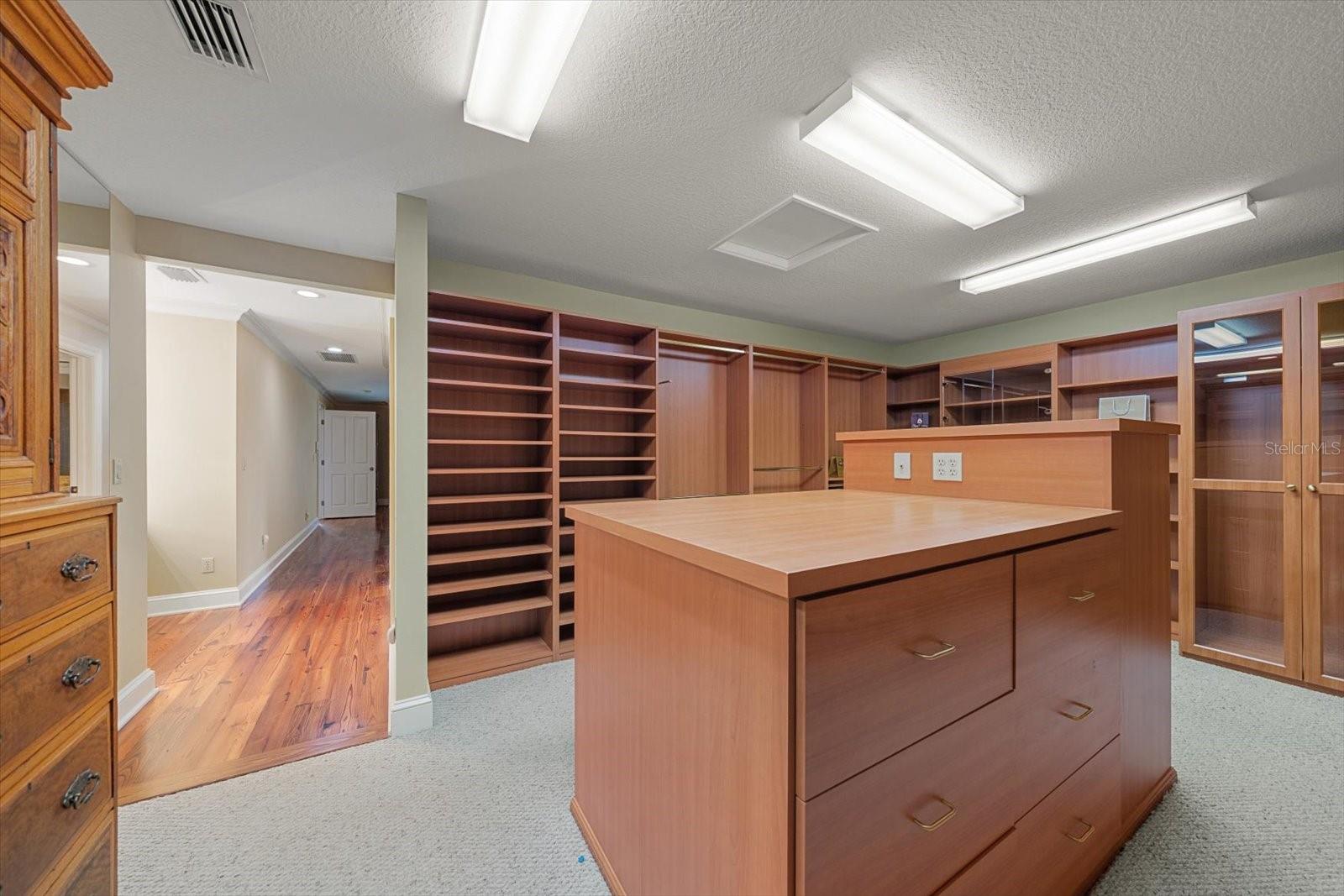 Primary closet in primary suite area.