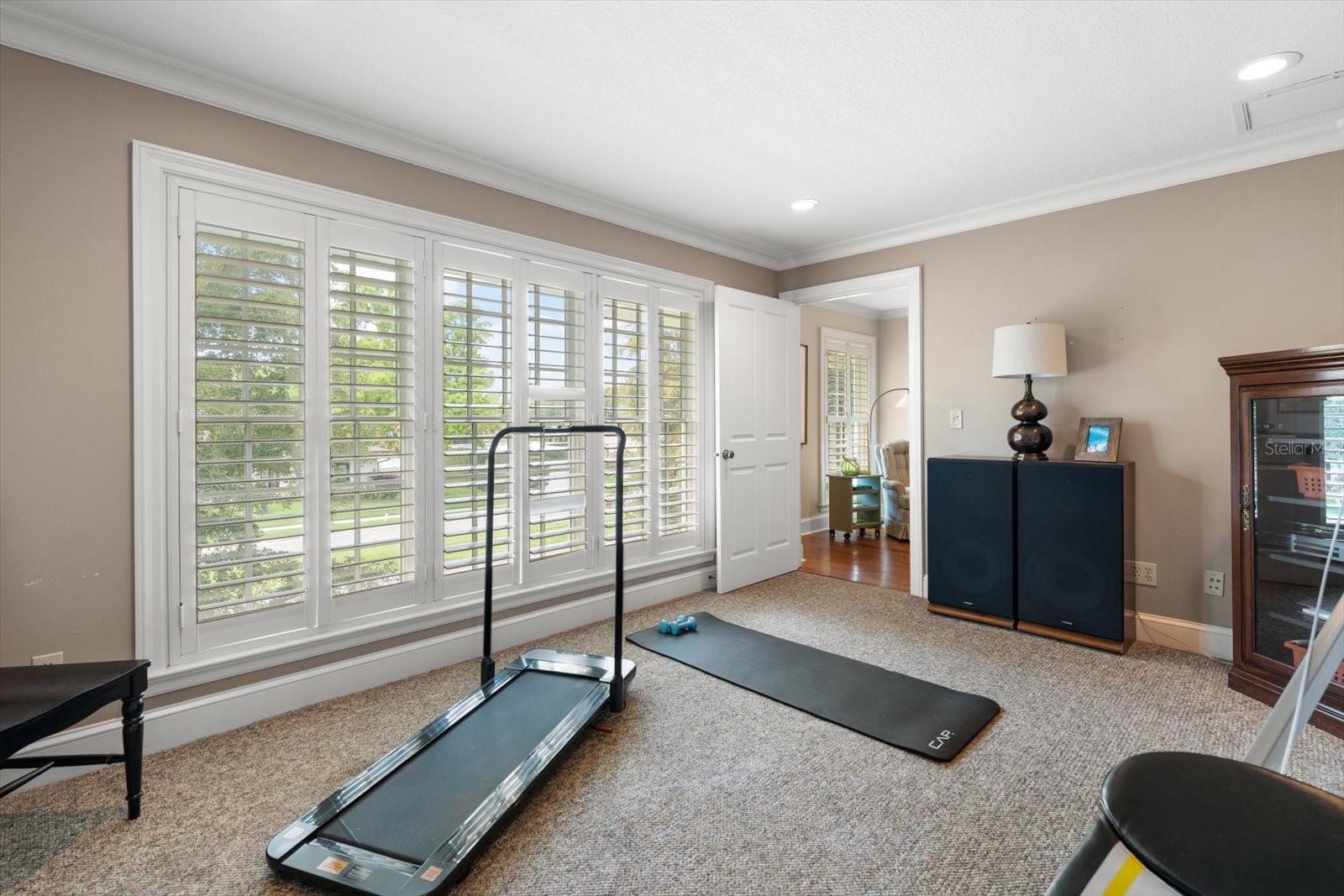 Exercise room with reinforced flooring-may be used for fourth bedroom.