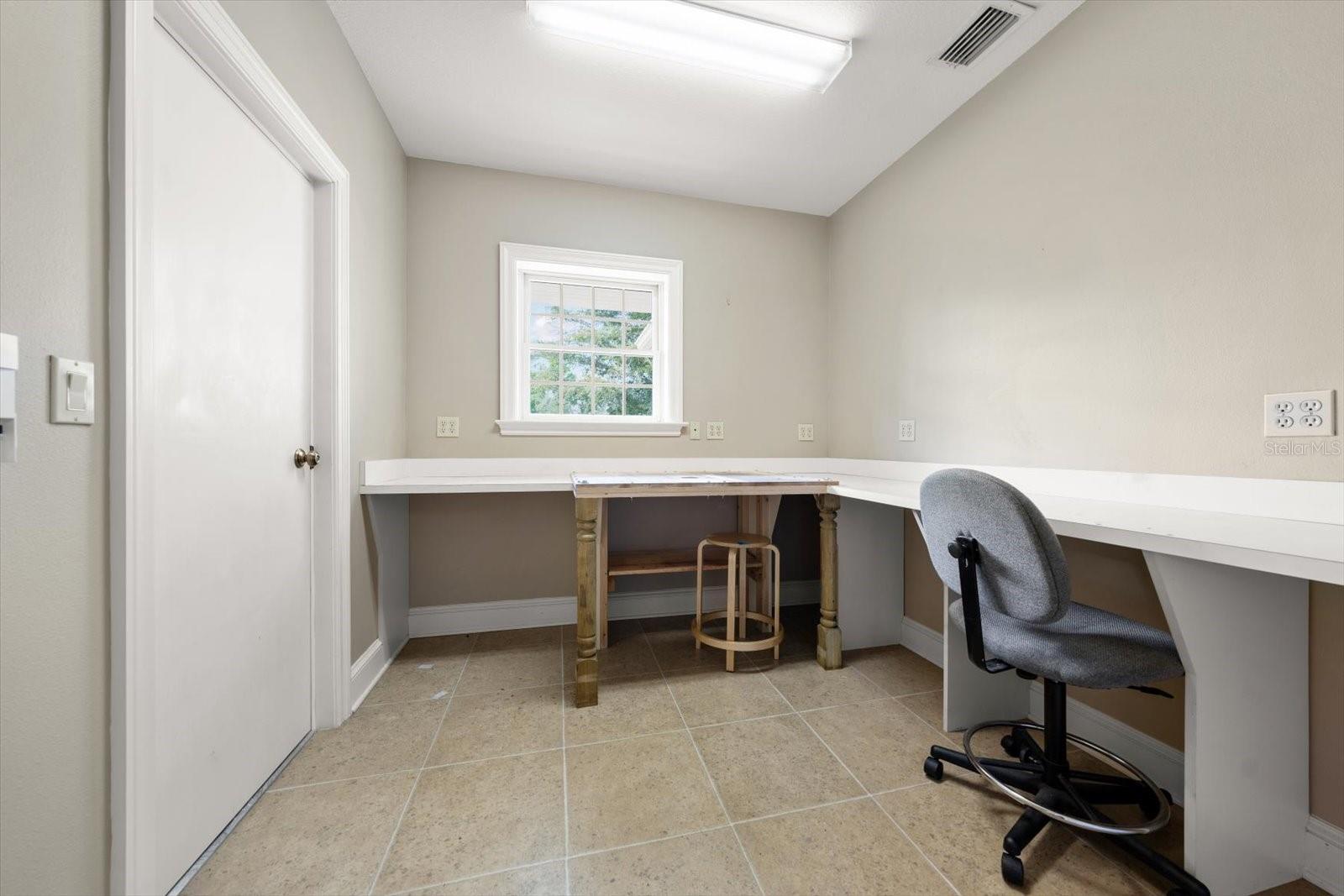 Climate controlled work shop room with separate area-great storage, hobby area, very versatile.