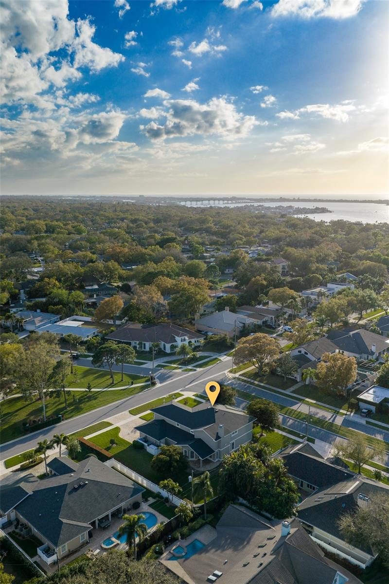 Poised on a desirable bluff, the residence offers security and substantial living areas.