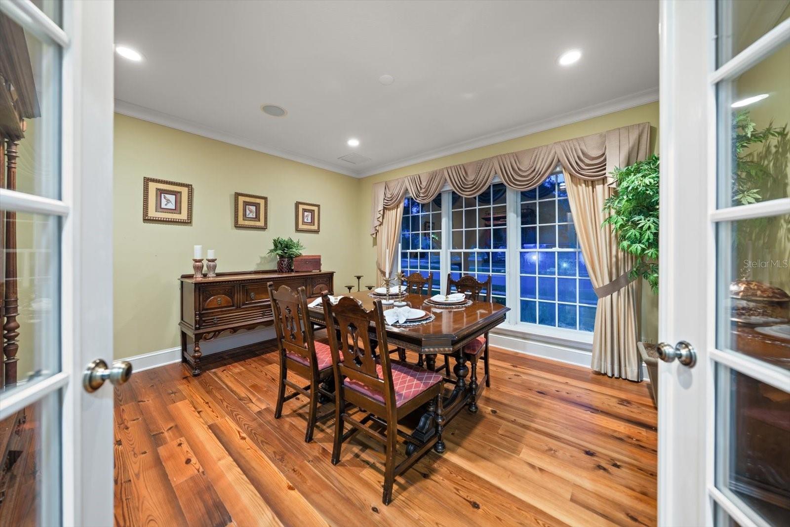 Dining room is timeless! Crown molding, exquisite Pine flooring contribute to the lovely finishes.