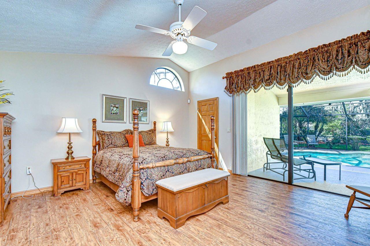 Primary Bedroom with pool view