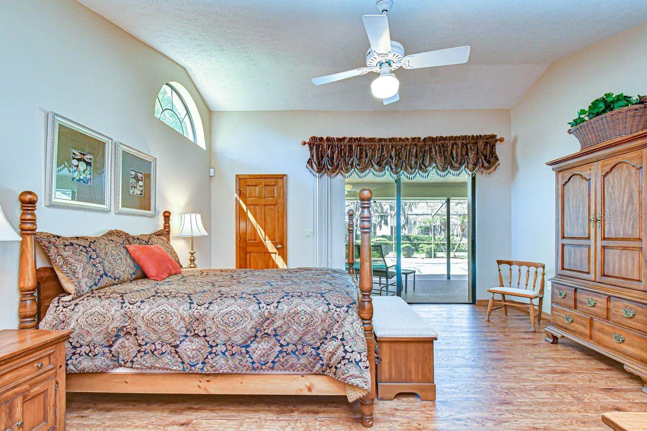 Primary Bedroom with sliders to the pool