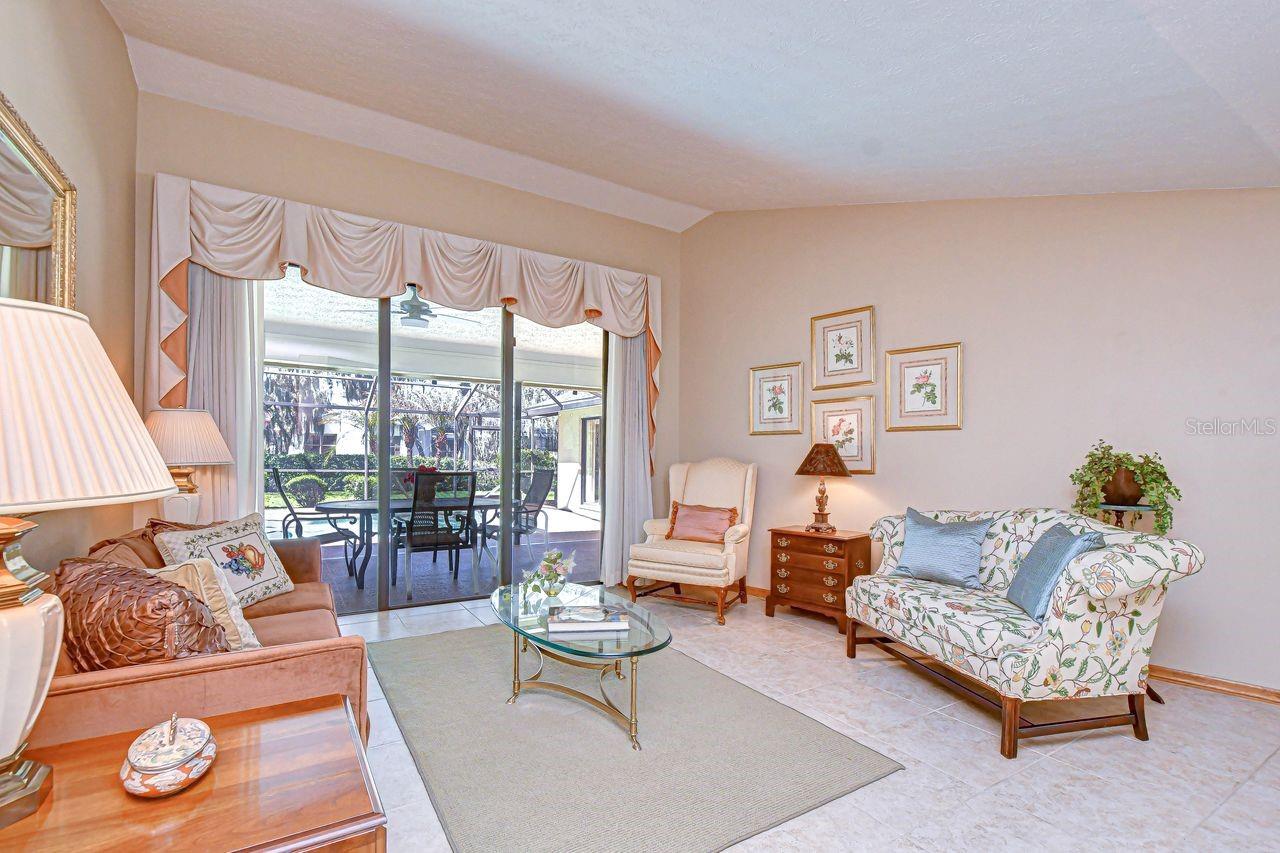 Living room with view of the pool