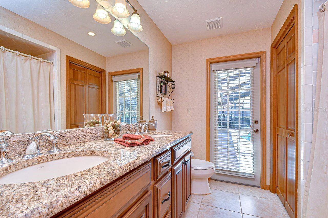 Bathroom 2 with door to pool