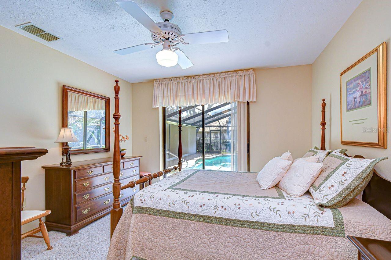 Bedroom 3 with slider to the pool