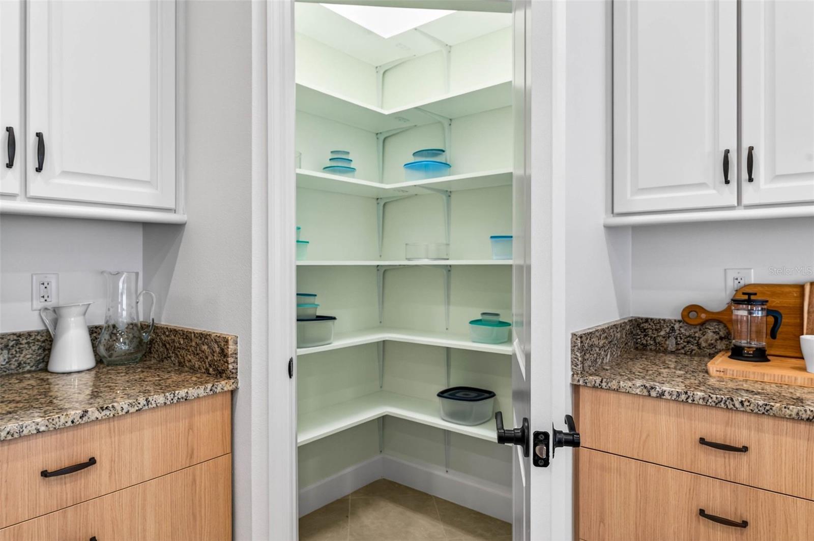 Closet pantry with upgraded shelving.