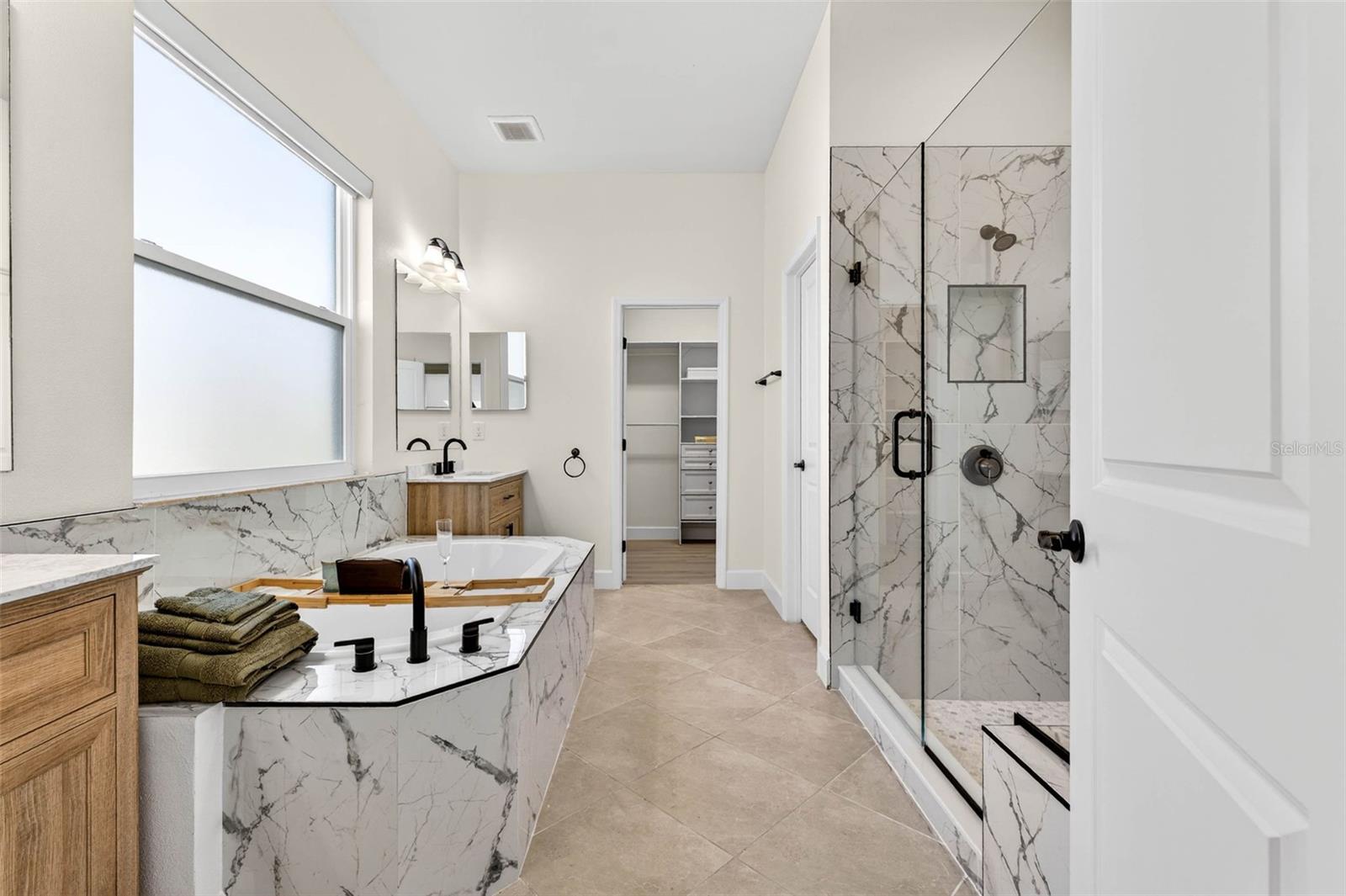 Soaking tub, walk in shower, upgraded double vanities.