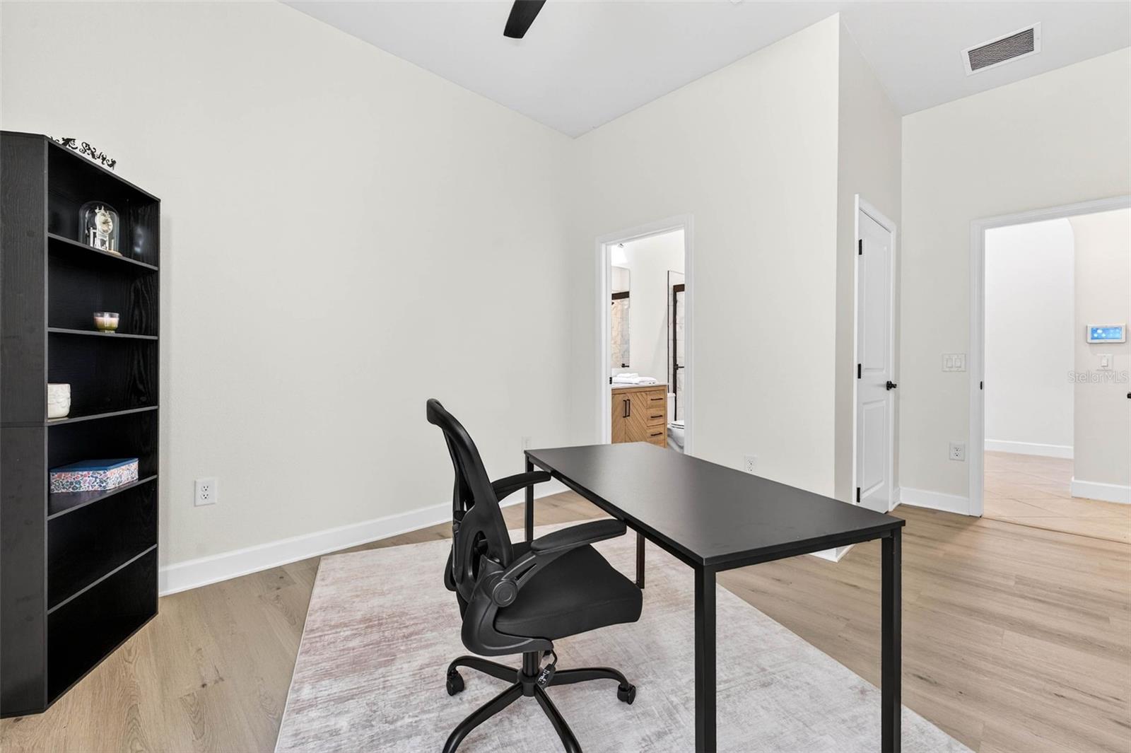 Bedroom 4 has its own ensuite bath- can be used as an office space or a full separate guest suite.