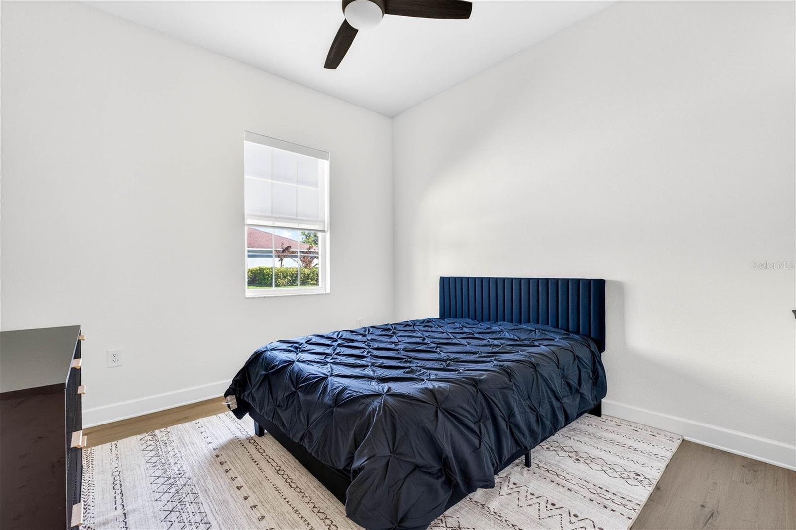 Bedroom 2 easily fits a queen bed with ample room.