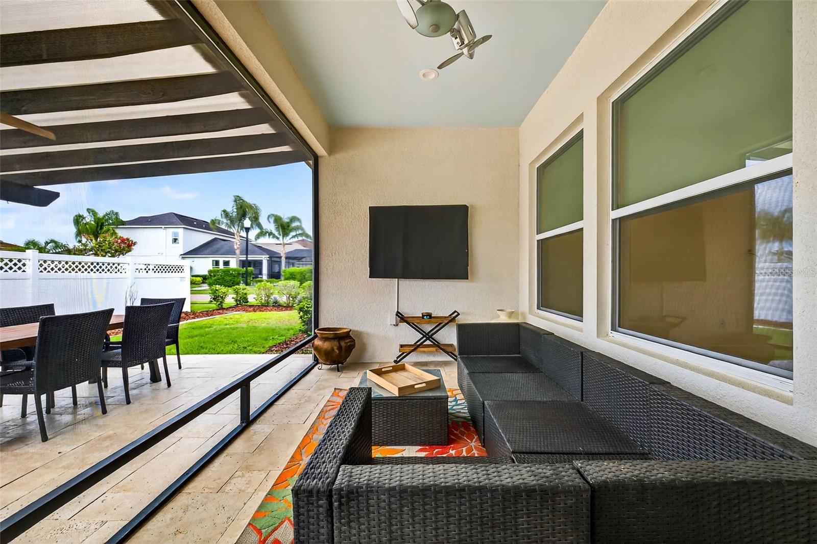 Your outdoor space is complete with a screened in lanai and upgraded travertine pavers.