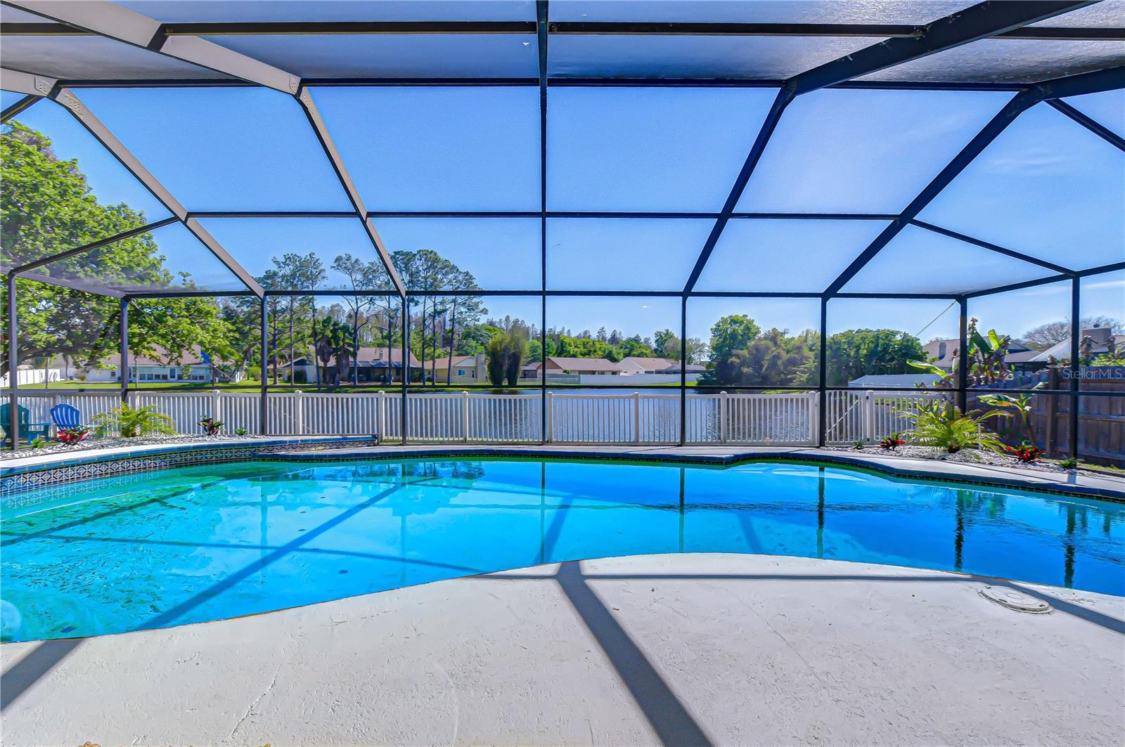 Pool Screen Enclosure Overlooking Pond