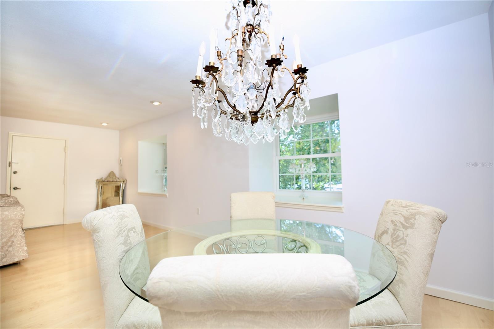 Two windows in living area brings the park like setting inside