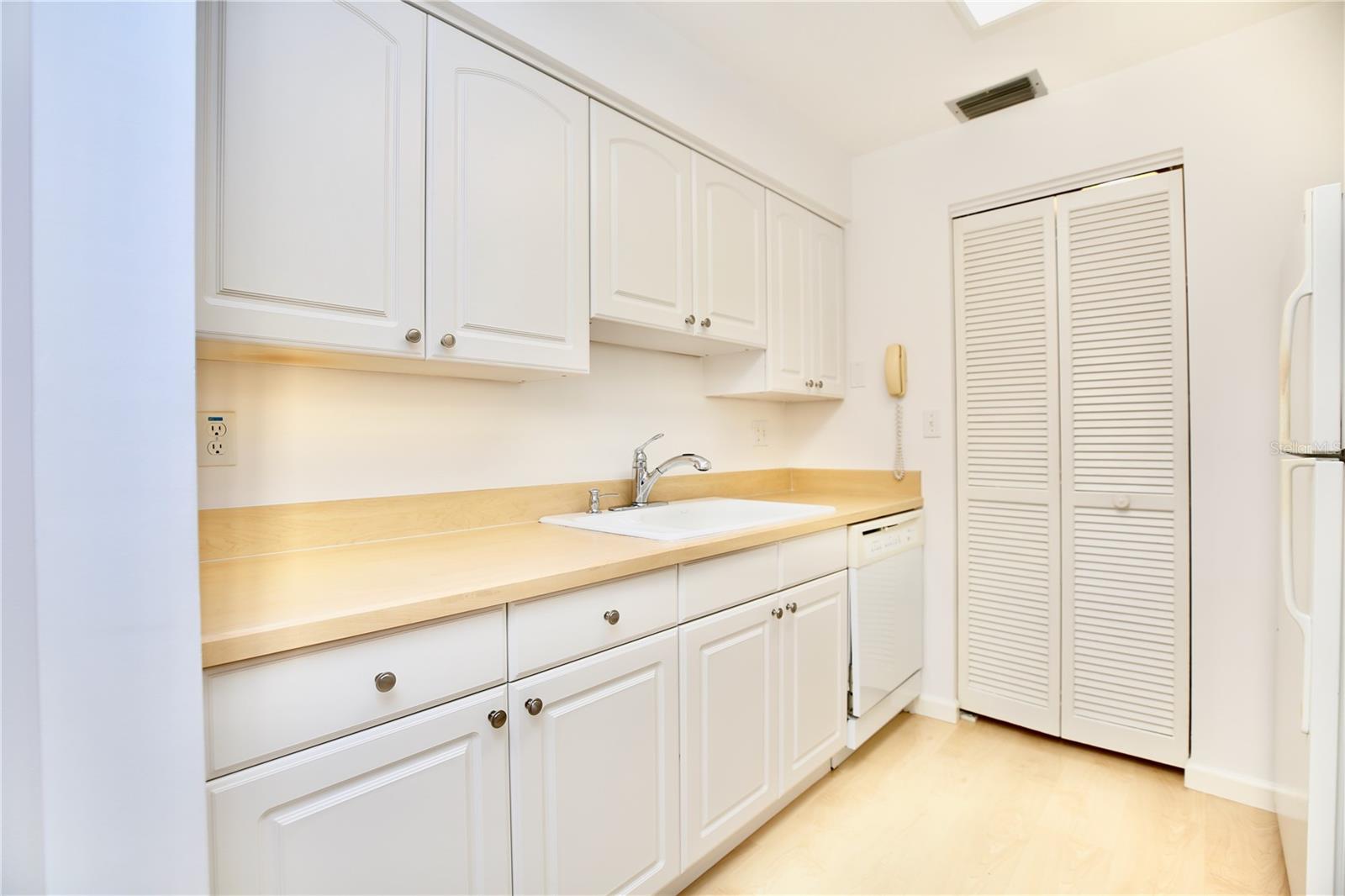 Plenty of counterspace and laundry closet location