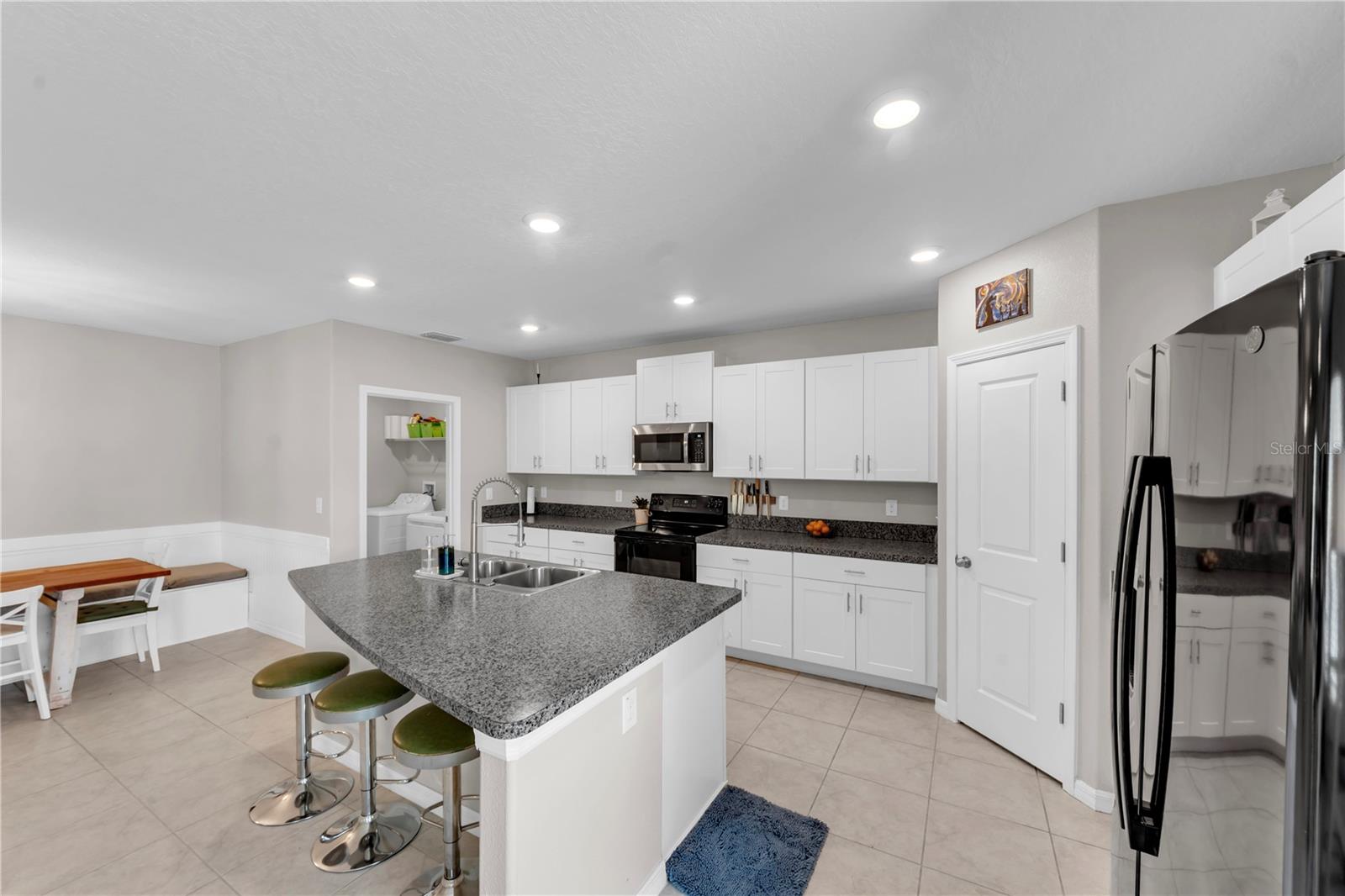 HUGE KITCHEN ISLAND! (Your laundry room leads to your 2-car garage.)