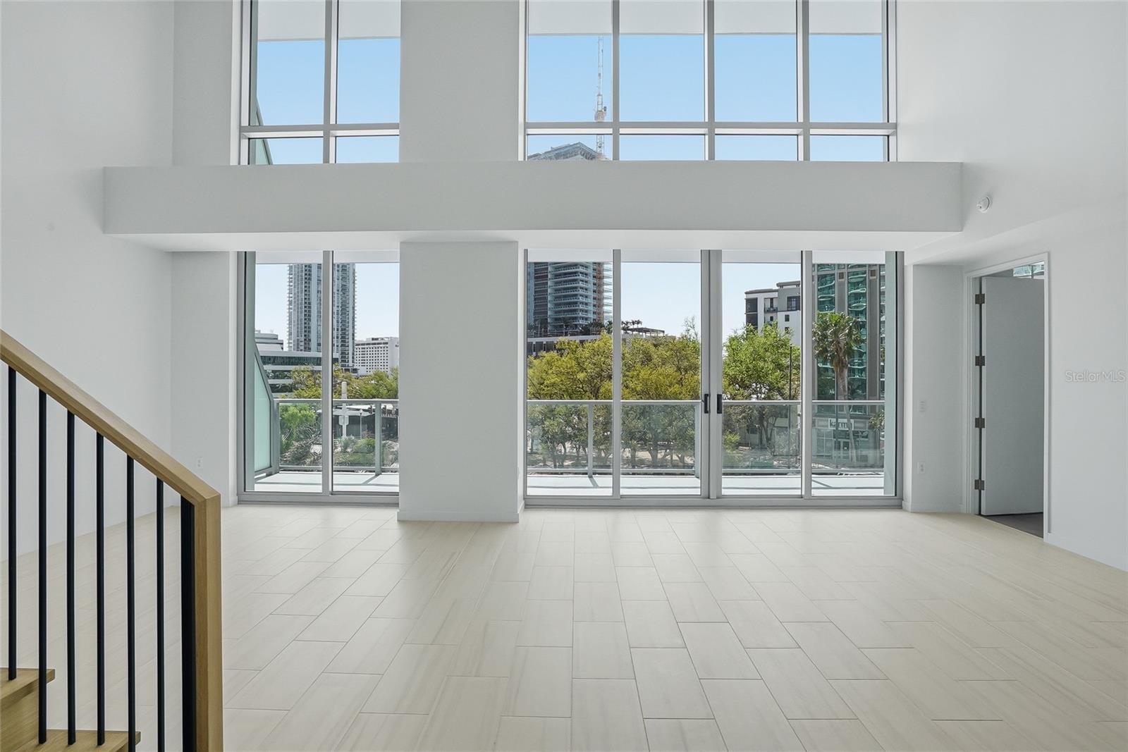 Welcome to the heart of downtown St Petersburg, Florida in a two story city home at 400 Central! A solid wall of expansive windows and extended balconies!