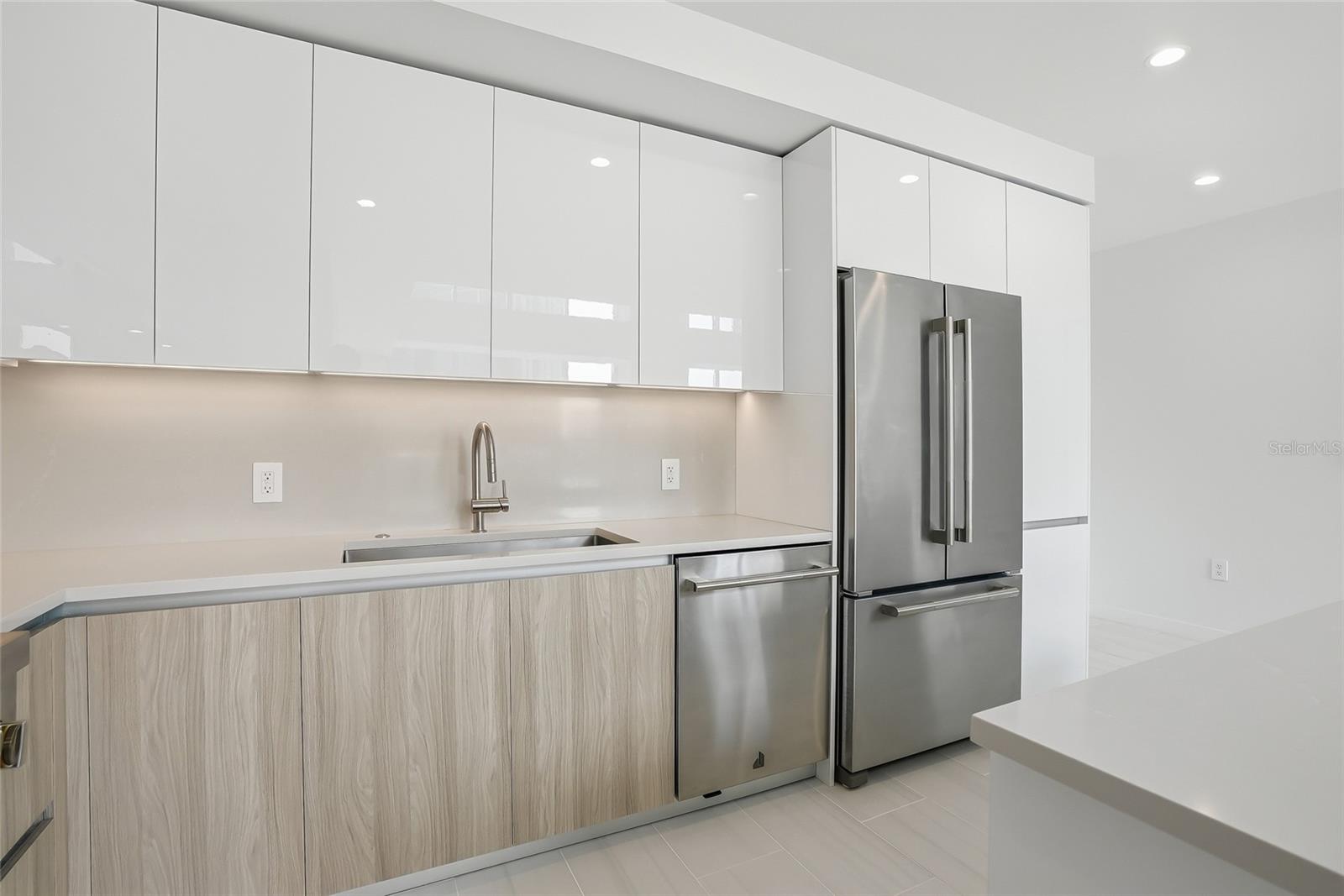 Dishwasher conveniently located next to the sink.  Spacious double door refrigerator with freezer drawer