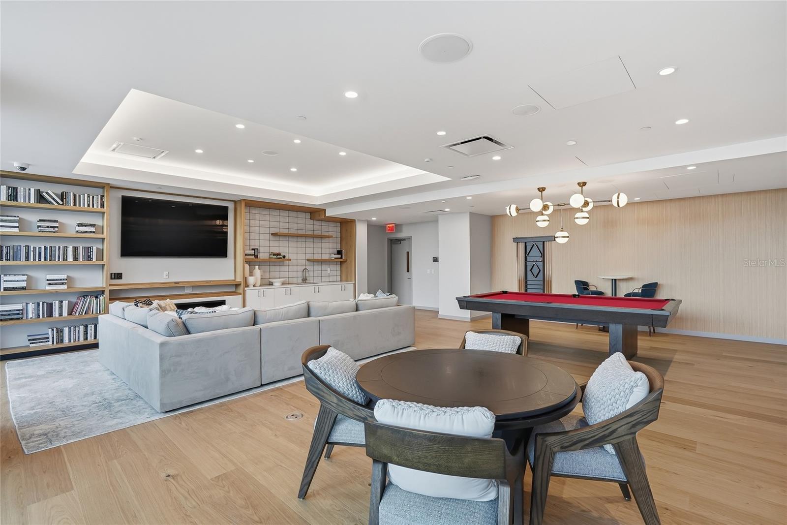 Game room which includes a pool table and card tables