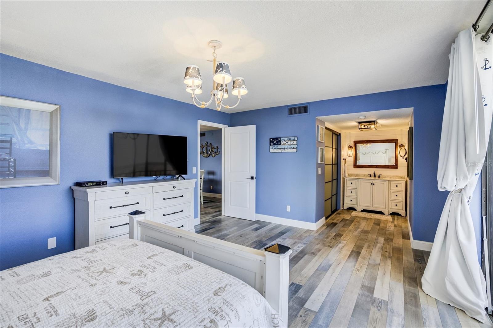 Primary Bedroom Into Bathroom