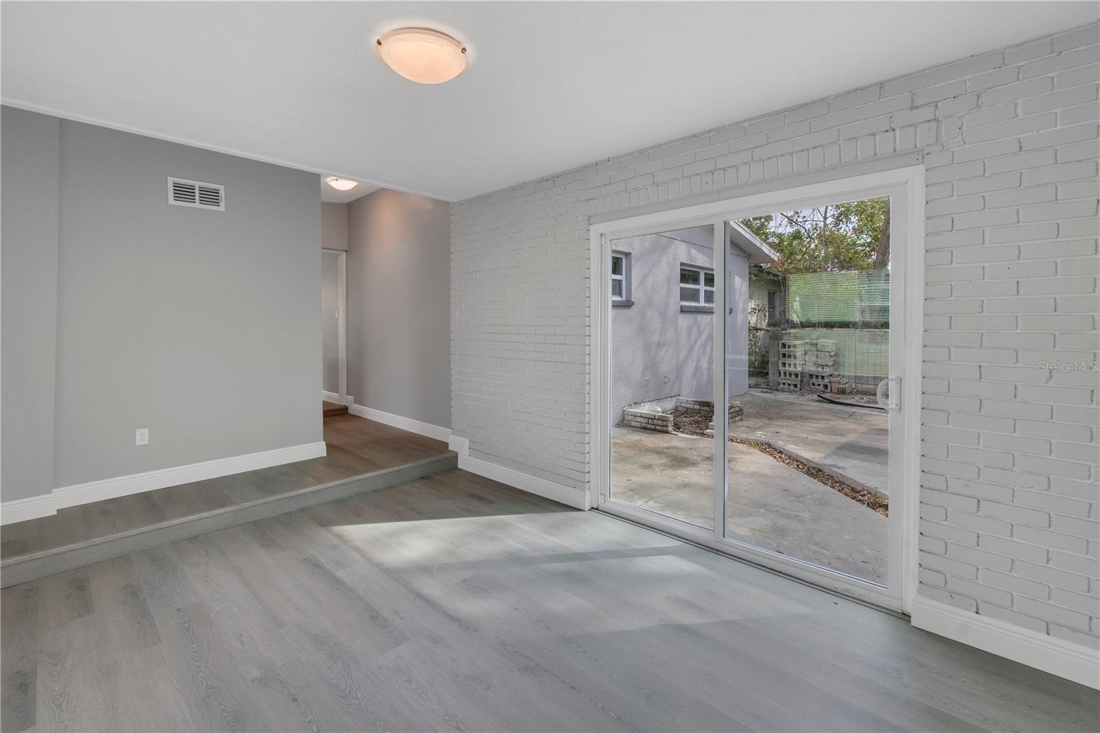 Den/family room with sliders leading to the back yard
