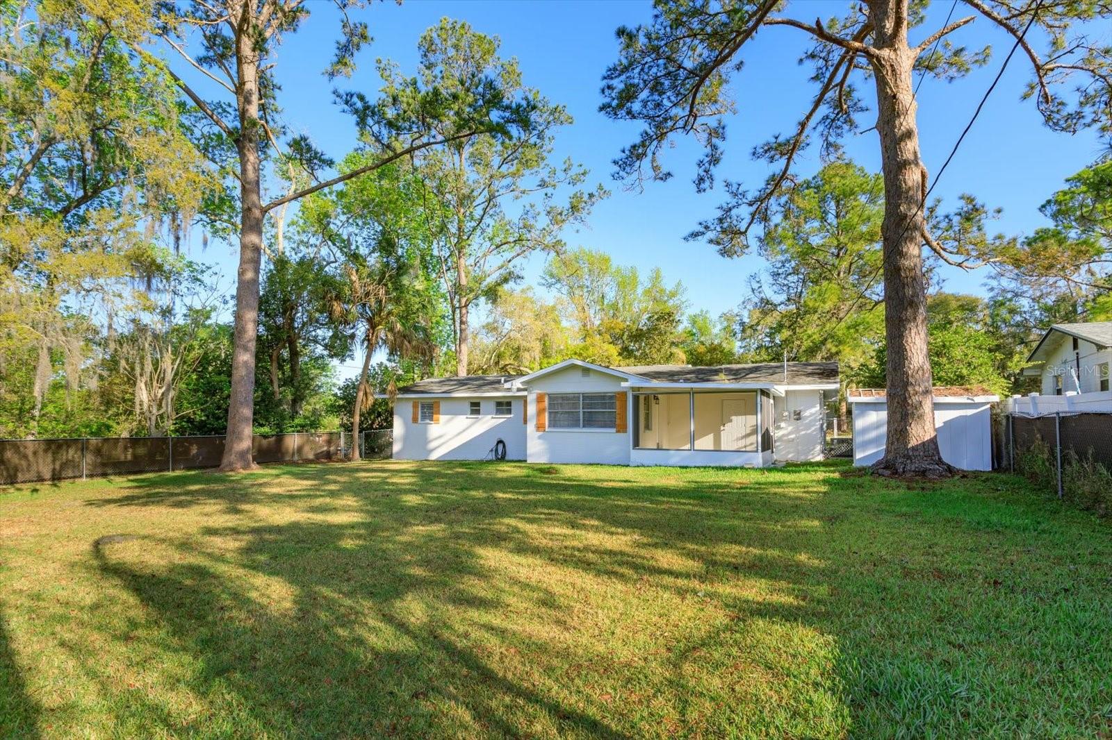 Freshly painted exterior home with new cedar shutters and screened in room! Shed!