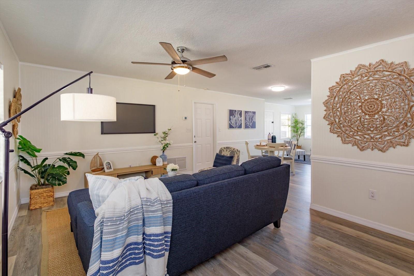 Open floor plan living room to kitchen and flex room/dining room.