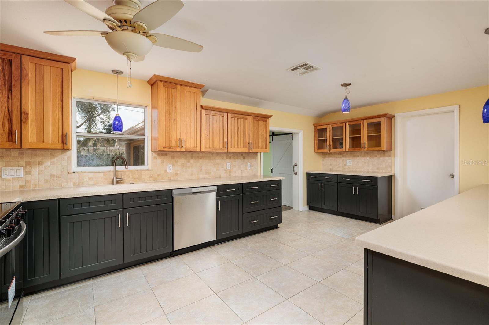 Kitchen - natural wood finish upper cabinets