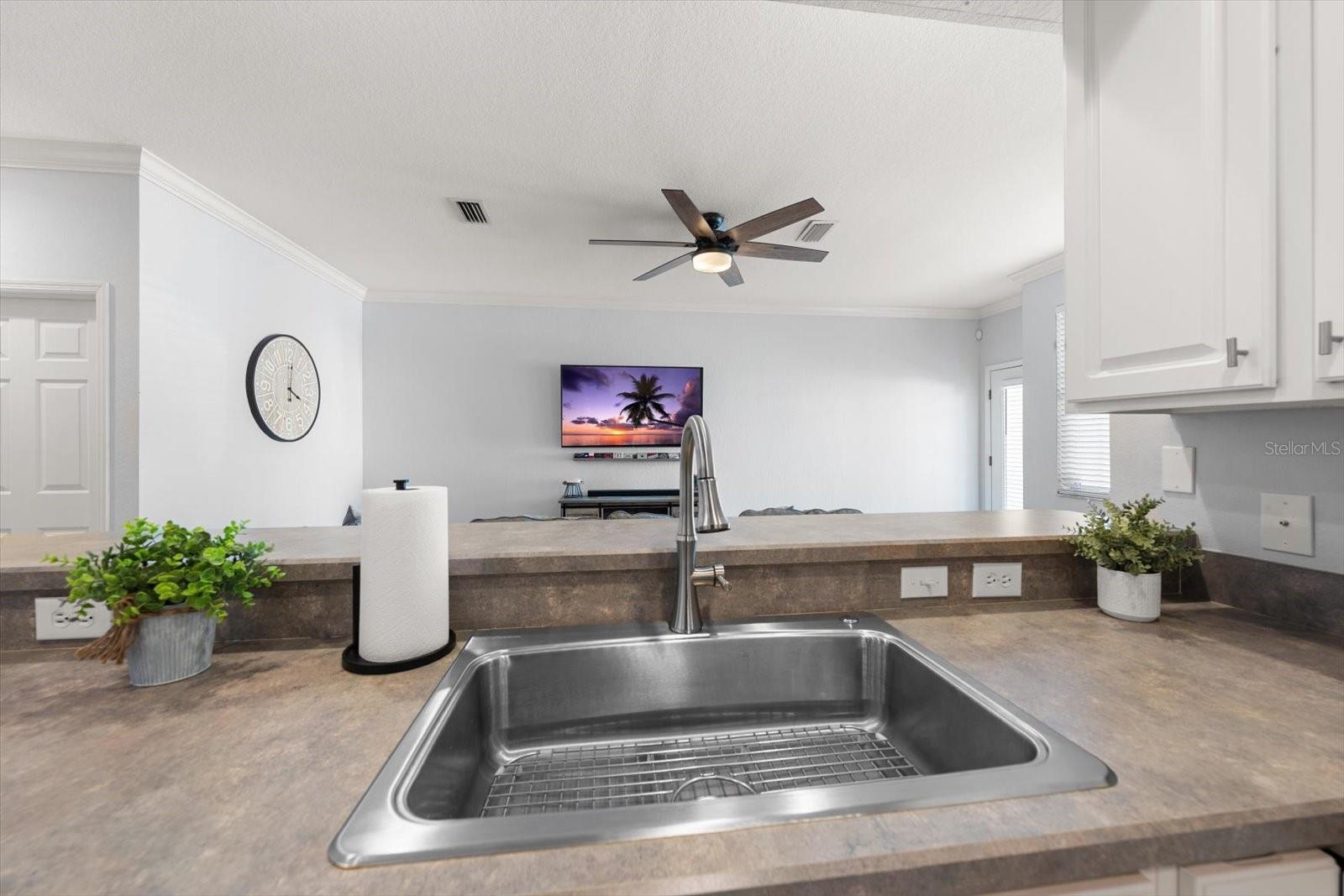 kitchen with breakfast bar, open to living room