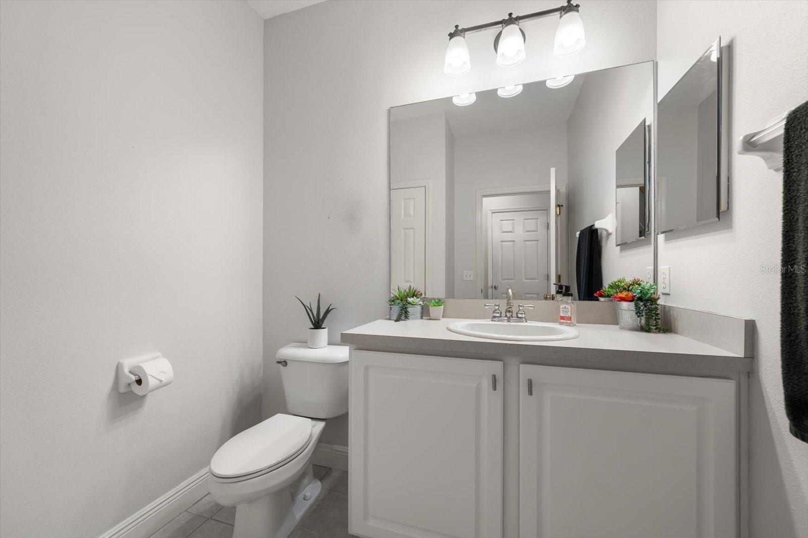 Half bath on main floor with linen closet