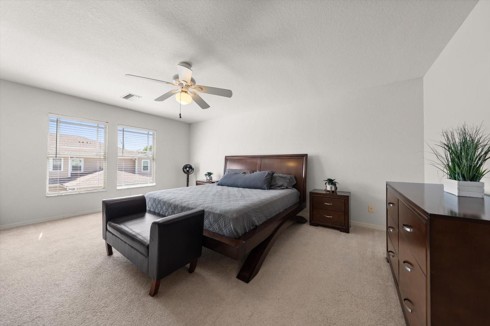 Spacious primary suite with huge walk in closet