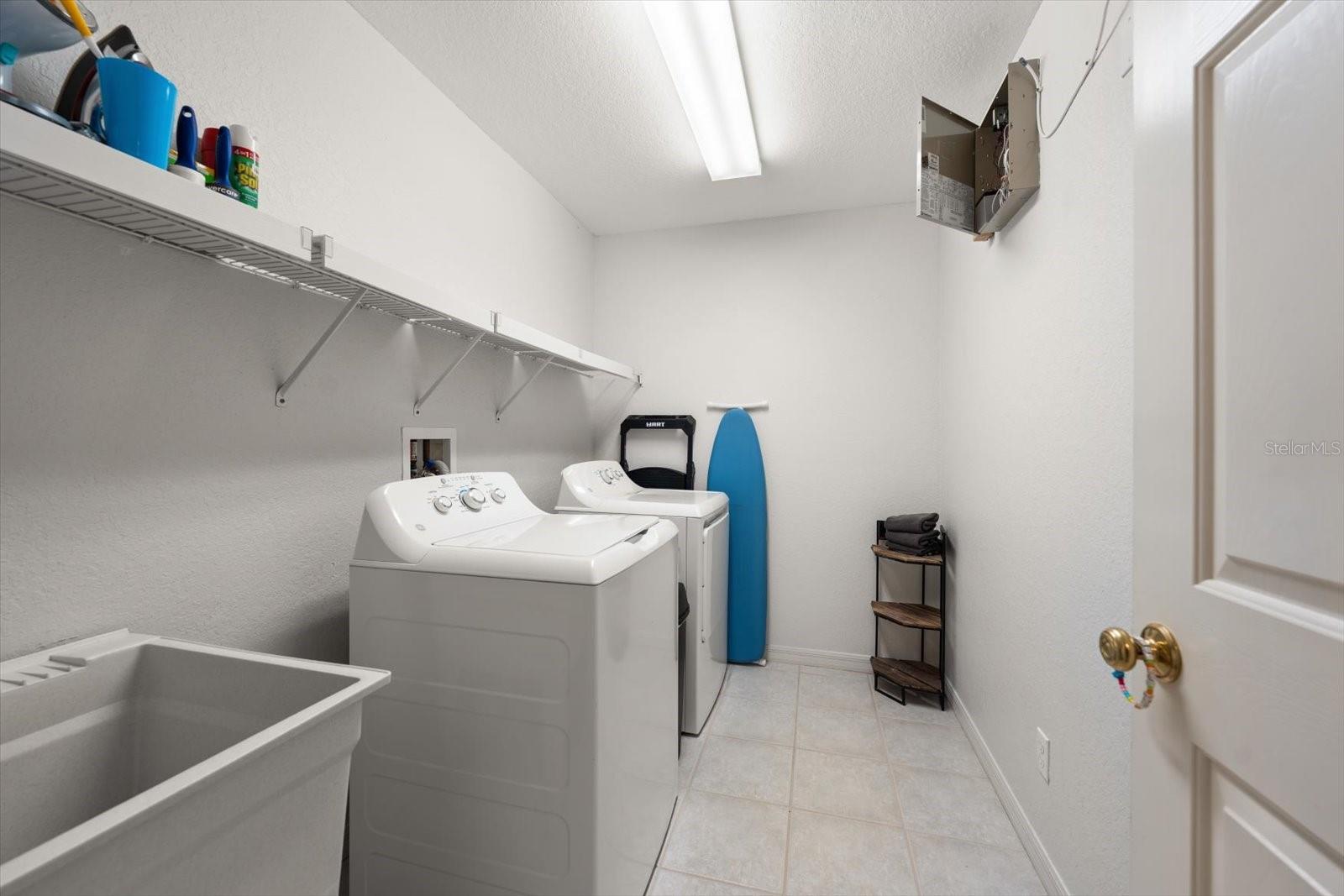 Upstairs laundry room, washer and dryer, utility sink