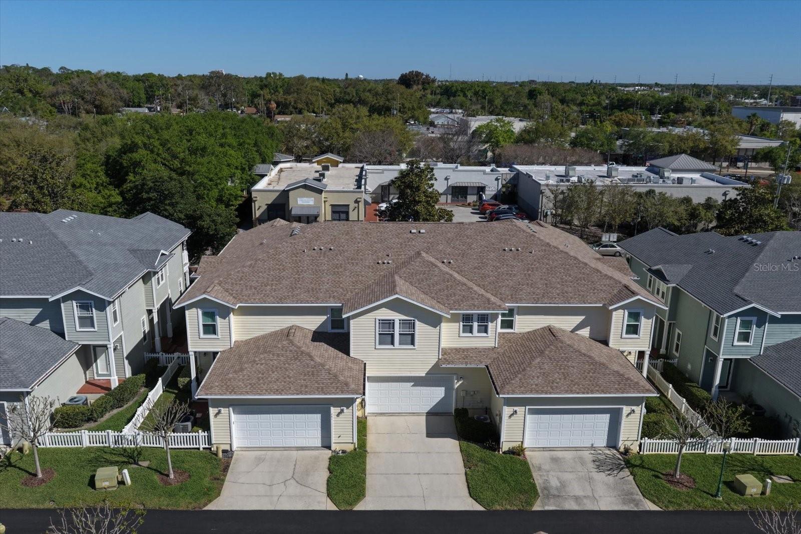 Aerial view back of home, deep driveway and alley access