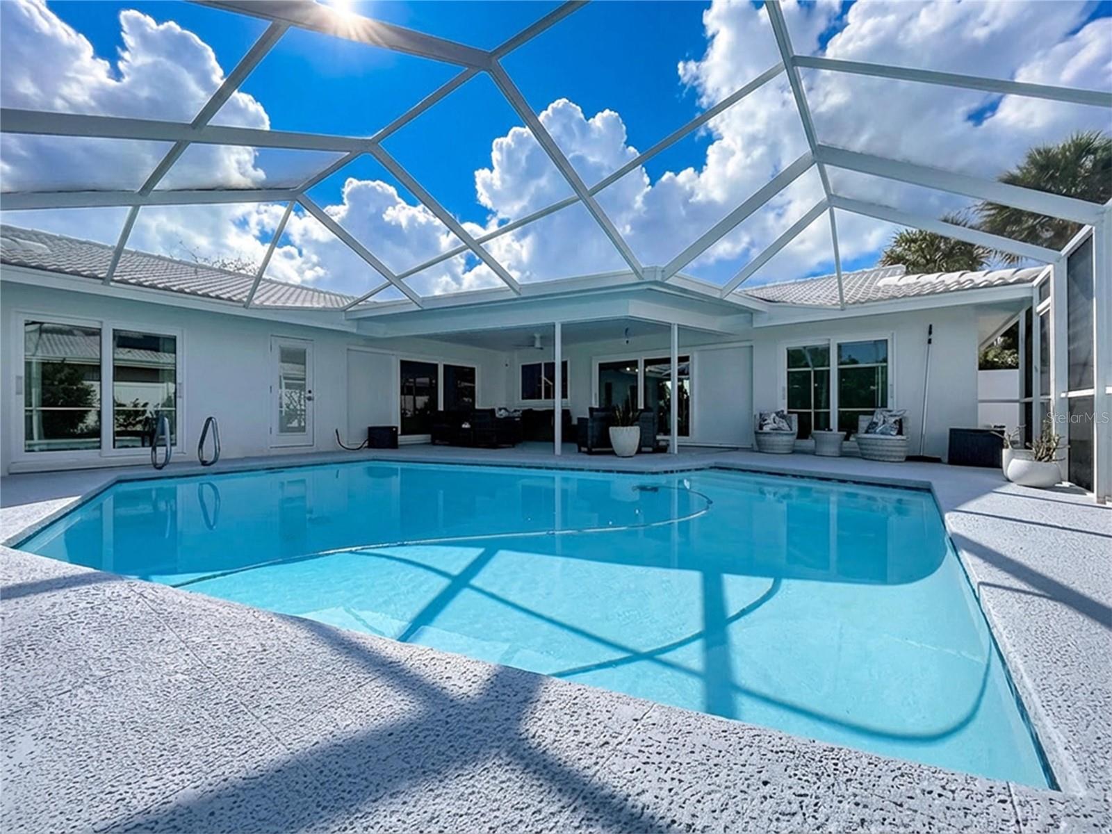 Screened pool enclosure with plenty of Florida sun.