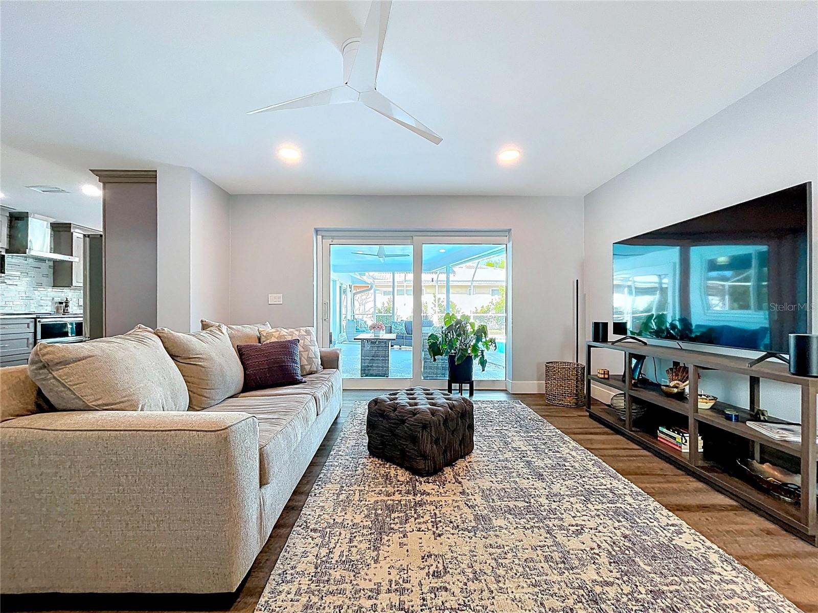 Two living rooms, both with views of the pool.