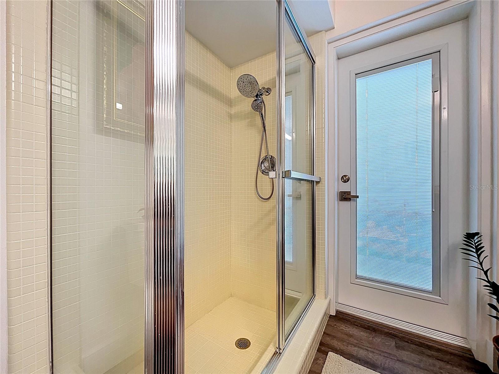 The 3rd bathroom offers access to the pool deck.