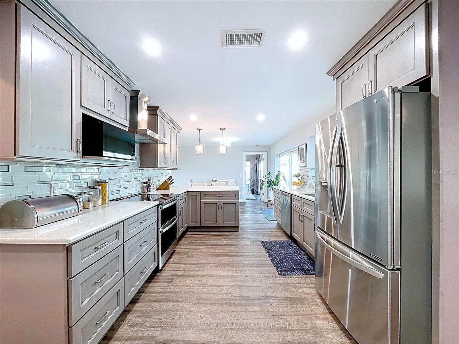 Fully updated kitchen with smooth textured ceiling and walls.