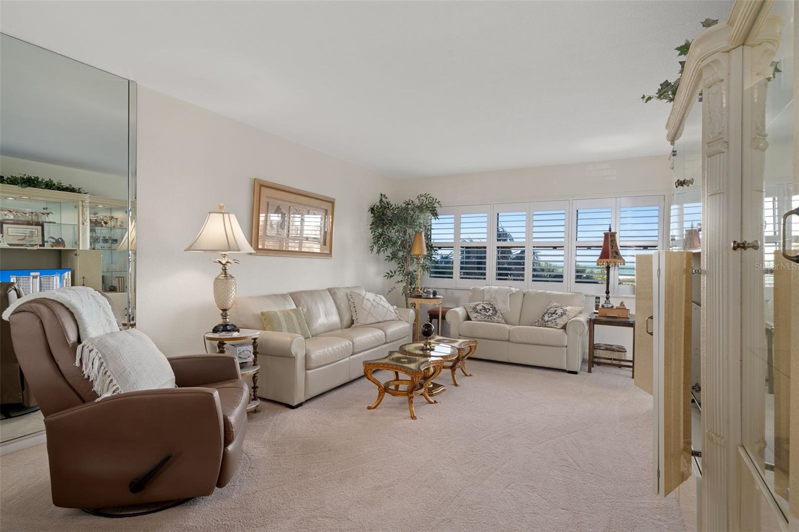 Cozy living area featuring leather furnishings and a view to the beautiful beach!