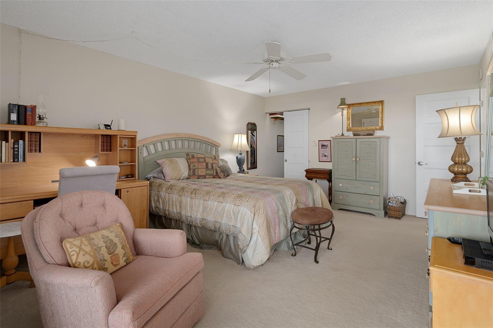 Primary bedroom offers a walk-in closet and an en-suite bathroom for added convenience