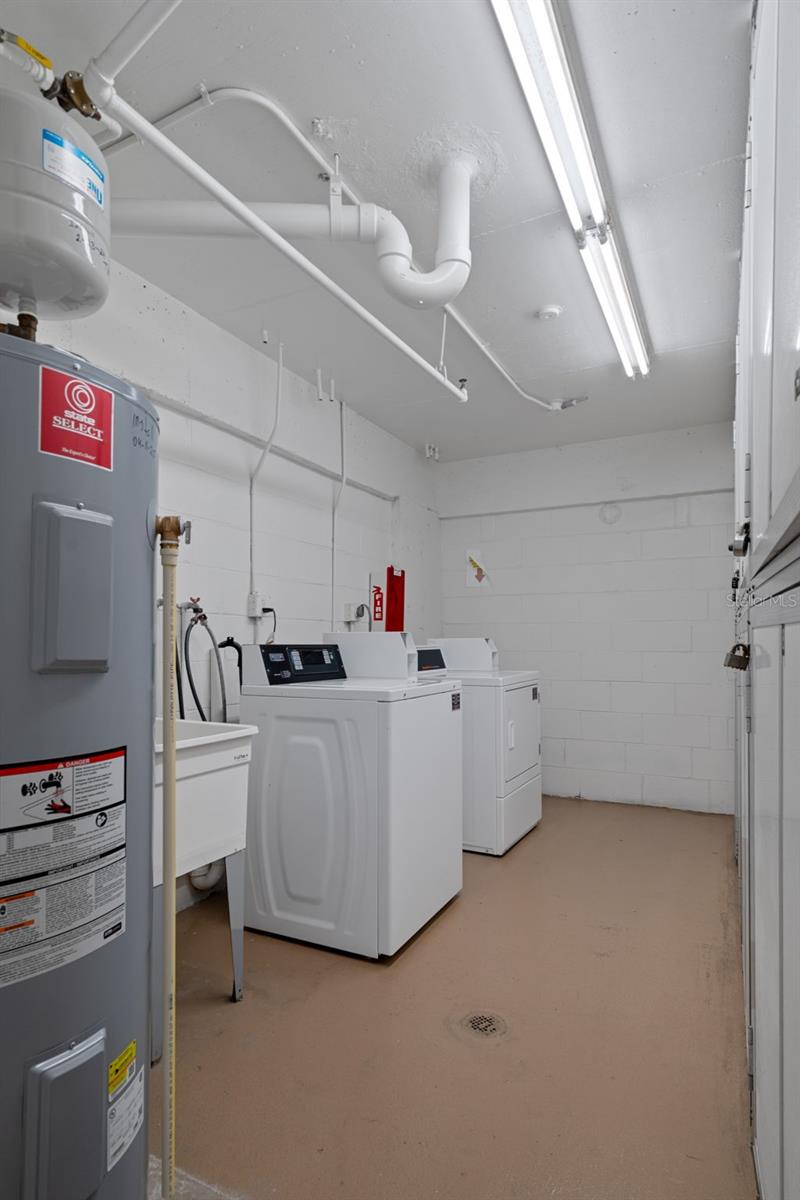 Laundry room with trash chute is conveniently located just down the hall on the same floor as unit