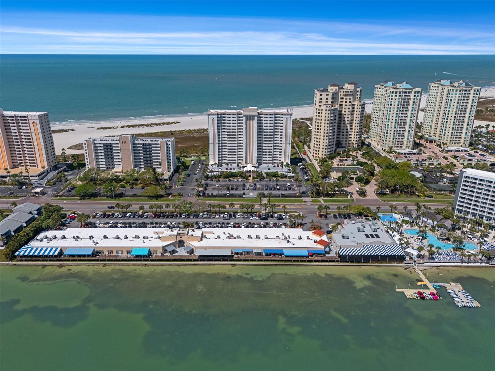 Aerial view of Shopping Center with restaurants (Columbia, Backwaters etc) with waterfront dining that is just across the street from the community!  A Marriott hotel offers extra accommodations for visiting guests plus jet ski and paddleboard rentals!
