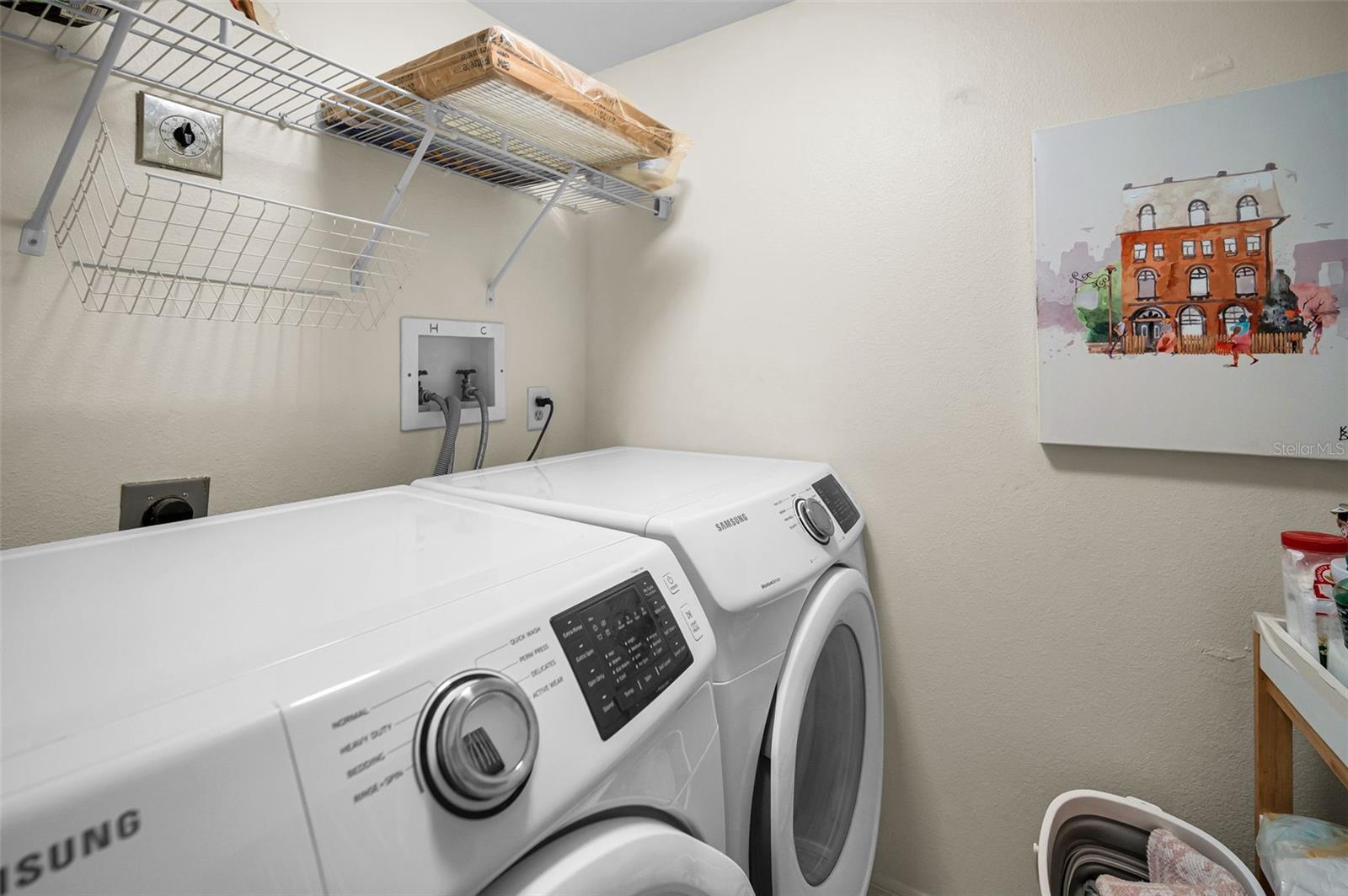 Inside laundry with new washer/dryer