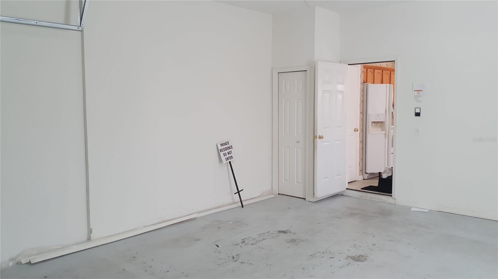 Garage has plenty of space for cars and storage