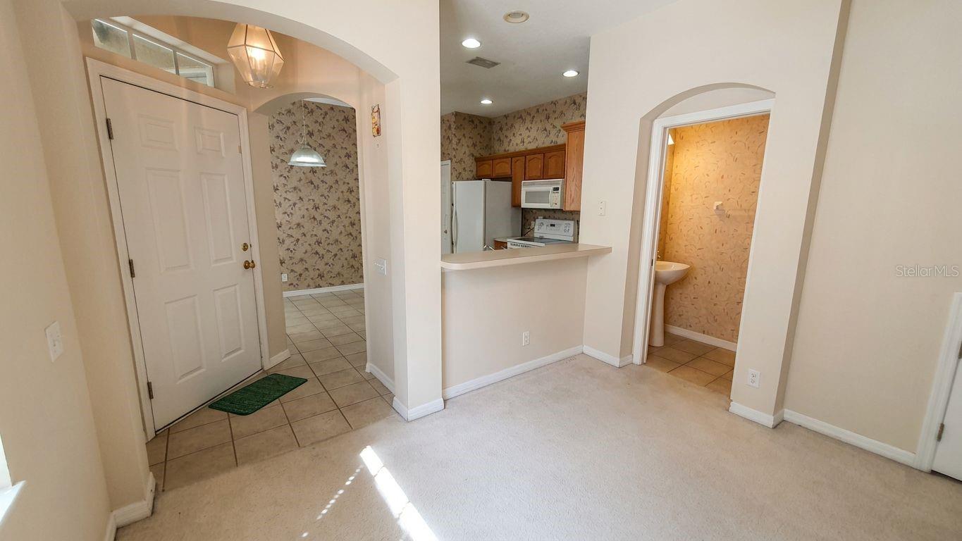 1st floor - view to kitchen, breakfast nook, half-bath