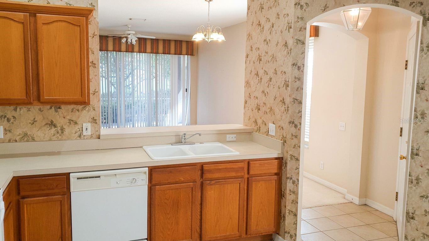 Kitchen features a pass-thru to the living-dining combo