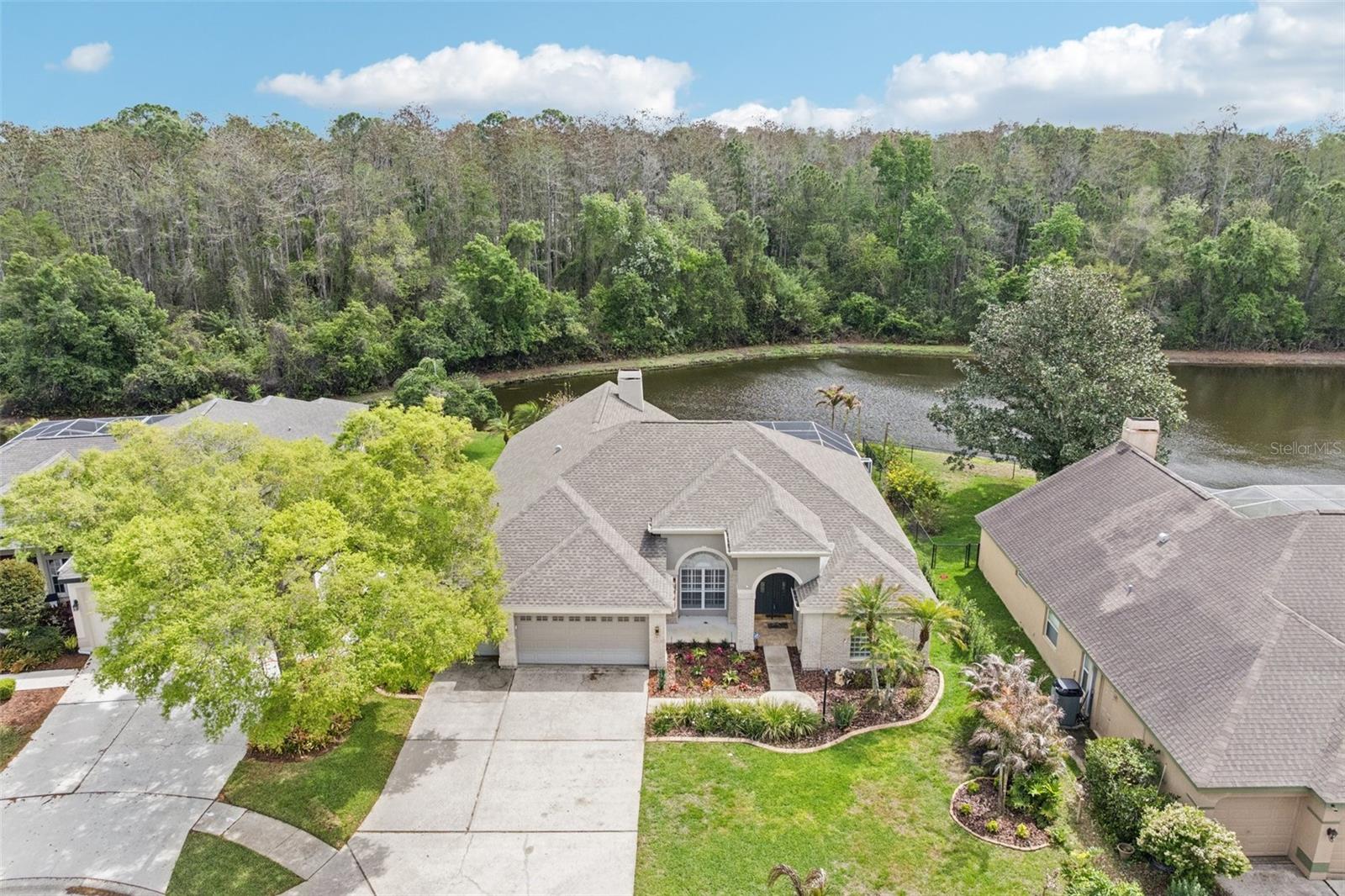 This lovely home is situated on a pond and conservation lot. Enjoy peaceful water and conservation views in a desirable neighborhood in Lansbrook.